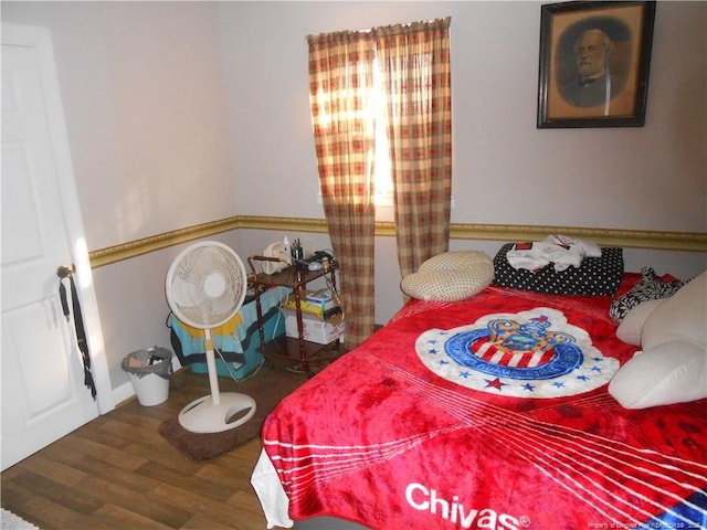 bedroom with wood finished floors