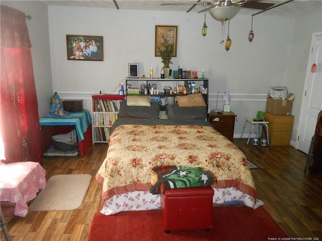 bedroom featuring wood finished floors