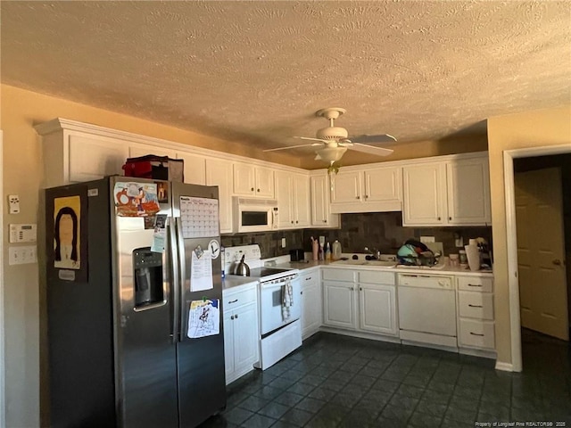 kitchen with ceiling fan, white appliances, a sink, and white cabinets