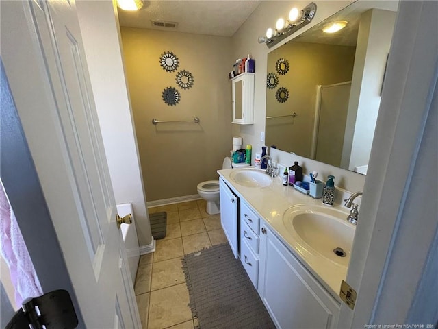 full bathroom featuring tile patterned flooring, visible vents, a sink, and a shower stall