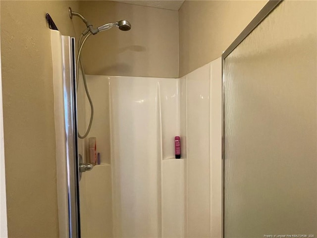 bathroom featuring a stall shower