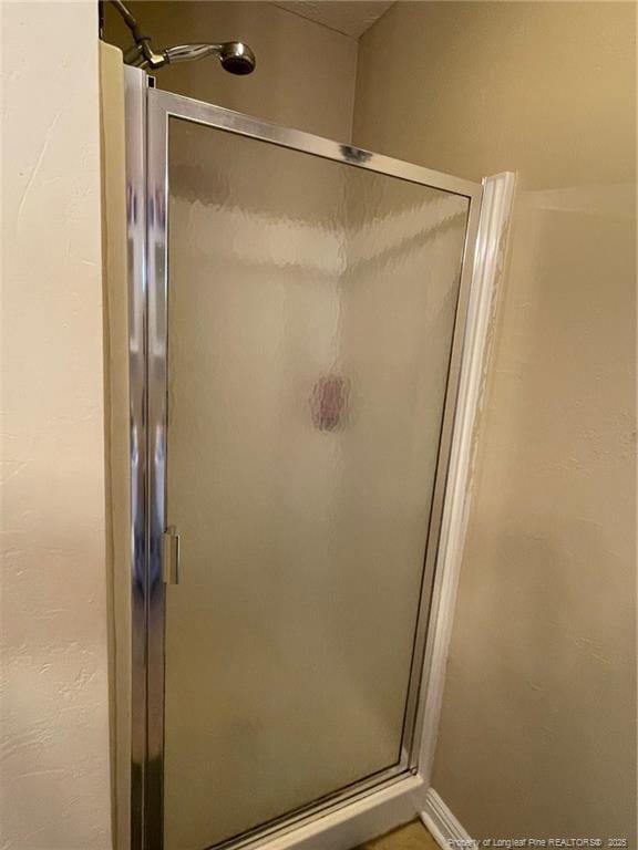 full bathroom with a stall shower