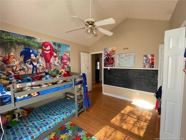 bedroom with lofted ceiling, ceiling fan, wood finished floors, and baseboards