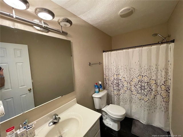 full bathroom with visible vents, a shower with shower curtain, toilet, a textured ceiling, and vanity