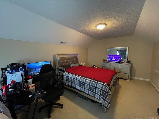 carpeted bedroom featuring baseboards, visible vents, vaulted ceiling, and a textured ceiling