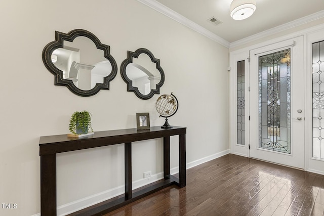 entryway with dark wood-style floors, visible vents, baseboards, and ornamental molding