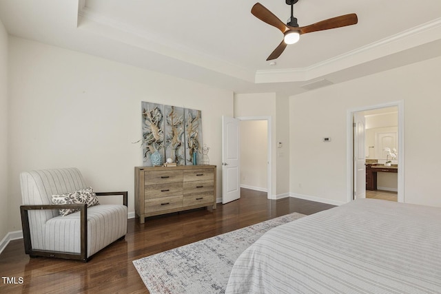 bedroom featuring a ceiling fan, wood finished floors, baseboards, crown molding, and a raised ceiling