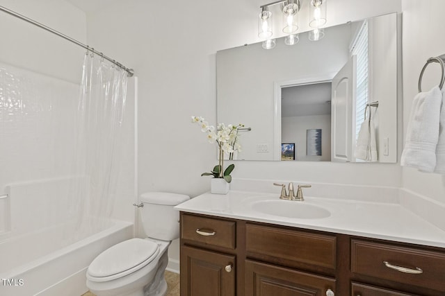 bathroom with vanity, toilet, and shower / bath combo