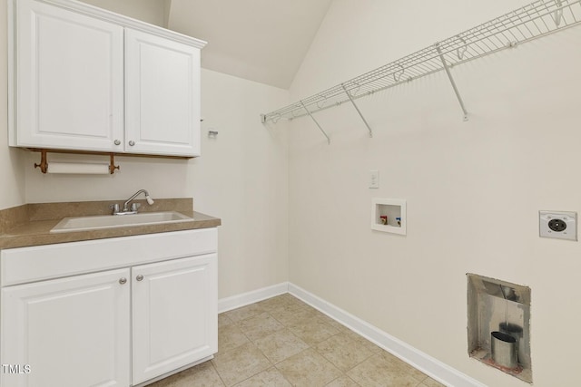 laundry area with baseboards, cabinet space, a sink, washer hookup, and electric dryer hookup