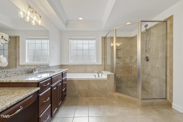 full bathroom with vanity, a raised ceiling, a stall shower, and ornamental molding