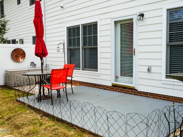 view of patio featuring fence