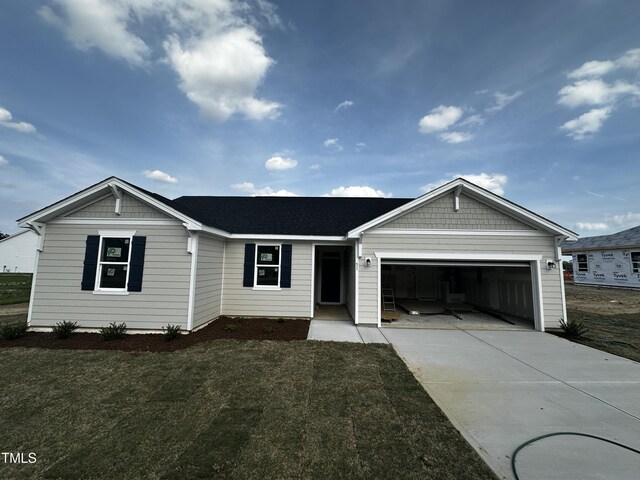51 Robert Howe Dr, Fuquay Varina, NC 27526 - single story home featuring a front yard, driveway, and an attached garage
