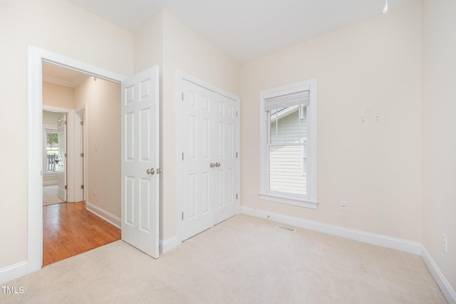 209 Homegate Cir, Apex, NC 27502 - unfurnished bedroom with light colored carpet and a closet