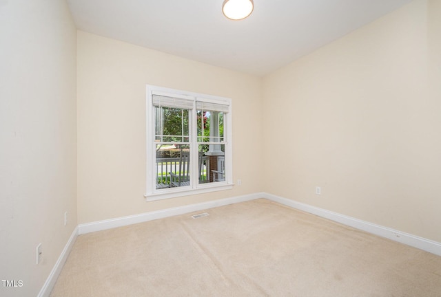 209 Homegate Cir, Apex, NC 27502 - spare room featuring light carpet and baseboards