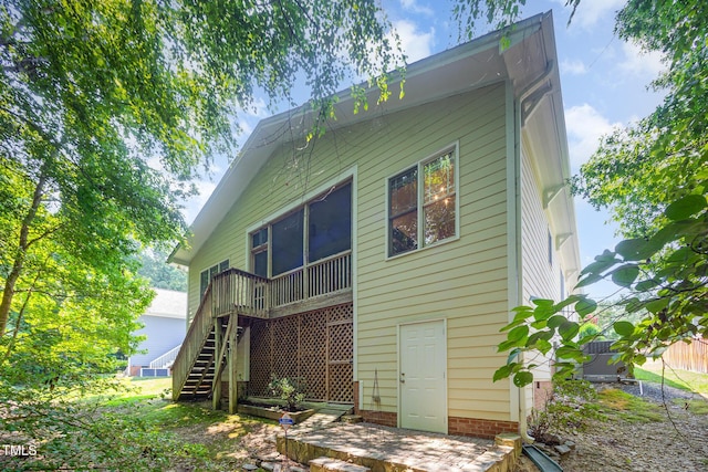 209 Homegate Cir, Apex, NC 27502 - back of property with stairway and a sunroom