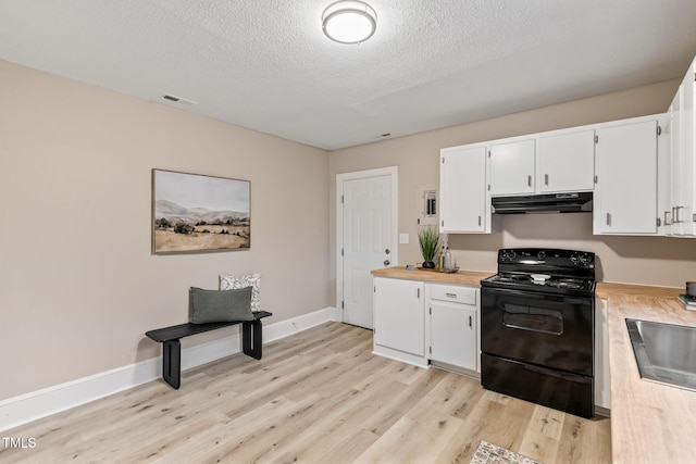 kitchen featuring electric range, visible vents, white cabinets, light wood-type flooring, and under cabinet range hood