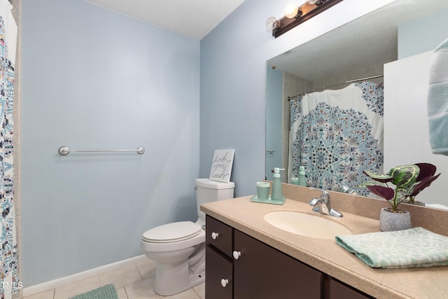 full bath with curtained shower, toilet, a textured ceiling, vanity, and tile patterned floors