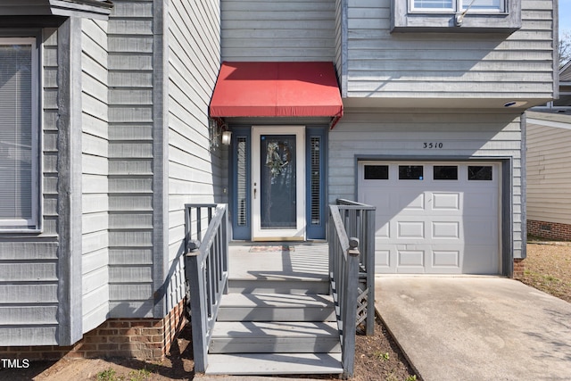 entrance to property with an attached garage