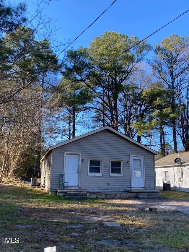 view of front of house featuring entry steps and central AC