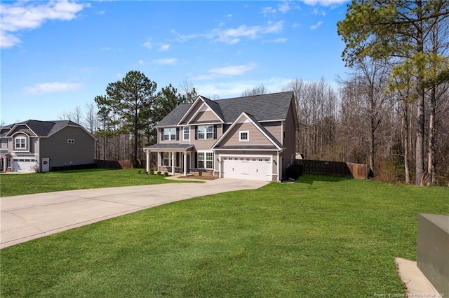 view of front of home with a garage, concrete driveway, a front yard, and fence