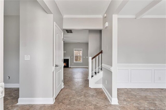 803 Equestrian Way, Raeford, NC 28376 - foyer featuring stairway, a lit fireplace, baseboards, ornamental molding, and stone finish floors