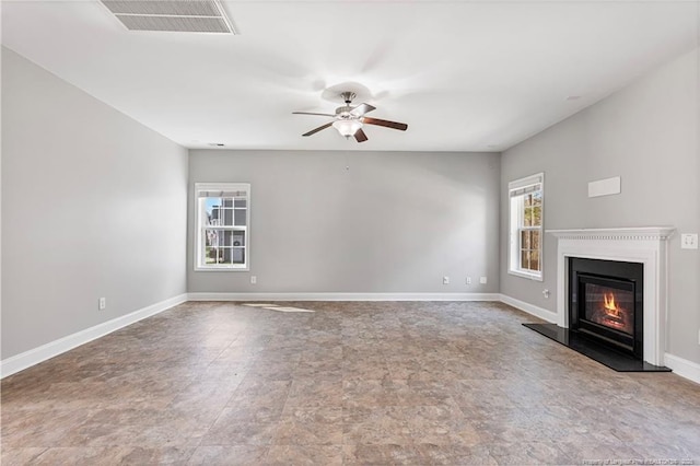 803 Equestrian Way, Raeford, NC 28376 - unfurnished living room featuring ceiling fan, a glass covered fireplace, and baseboards