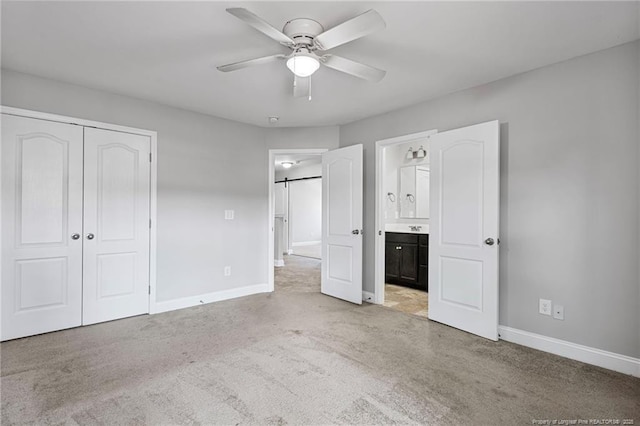 803 Equestrian Way, Raeford, NC 28376 - unfurnished bedroom featuring carpet, baseboards, a closet, ensuite bathroom, and ceiling fan