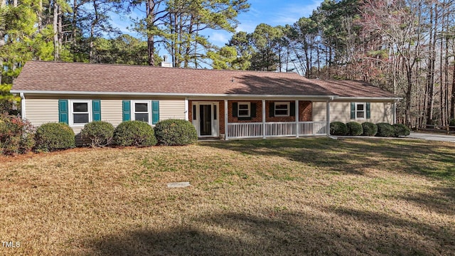 single story home with a chimney, a front lawn, roof with shingles, and a porch