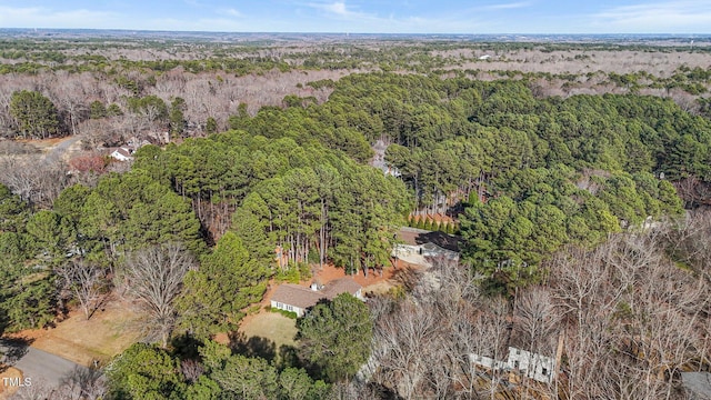 aerial view featuring a wooded view