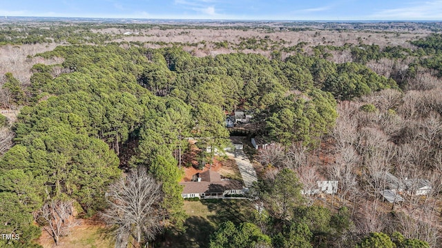 bird's eye view featuring a wooded view