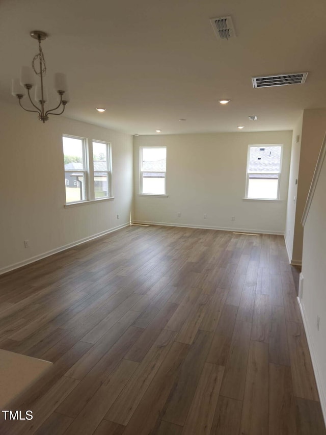 28 Longdale Dr, Graham, NC 27253 - empty room with wood finished floors, a chandelier, and recessed lighting