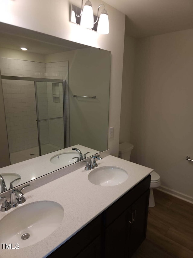 28 Longdale Dr, Graham, NC 27253 - bathroom with wood finished floors, a shower stall, and double vanity