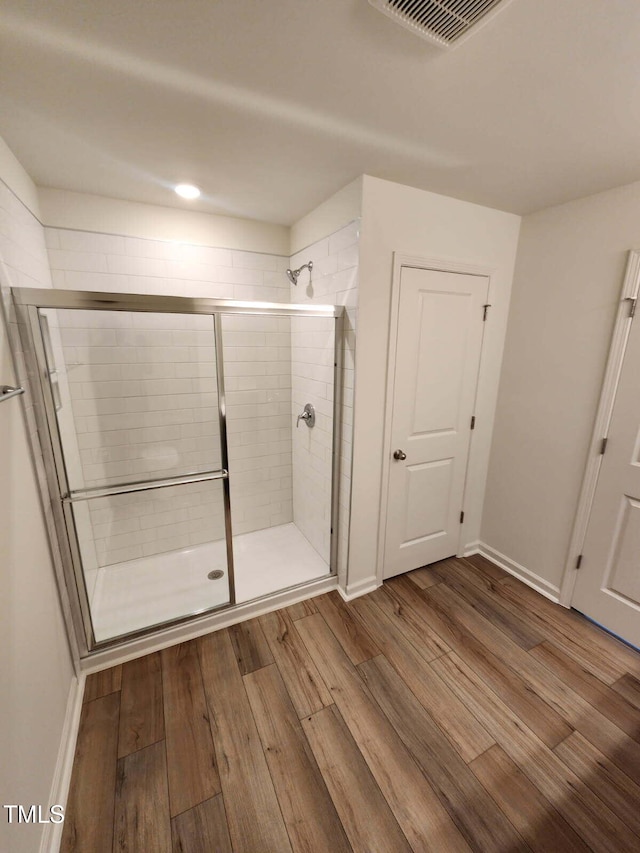 28 Longdale Dr, Graham, NC 27253 - bathroom with wood finished floors and a stall shower