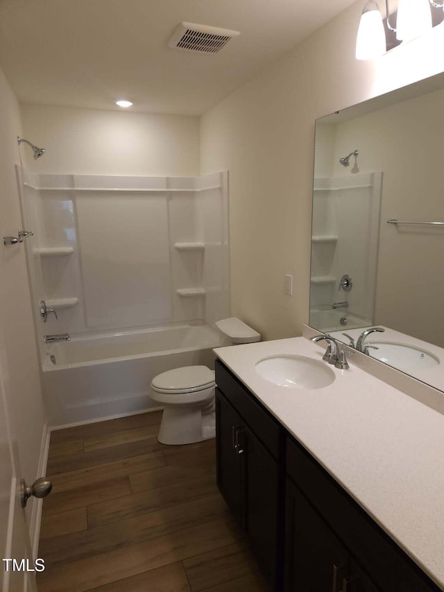 28 Longdale Dr, Graham, NC 27253 - bathroom featuring vanity, shower / washtub combination, wood finished floors, and recessed lighting