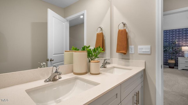 full bathroom featuring double vanity and a sink