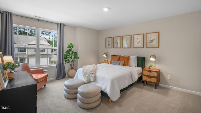 carpeted bedroom featuring baseboards