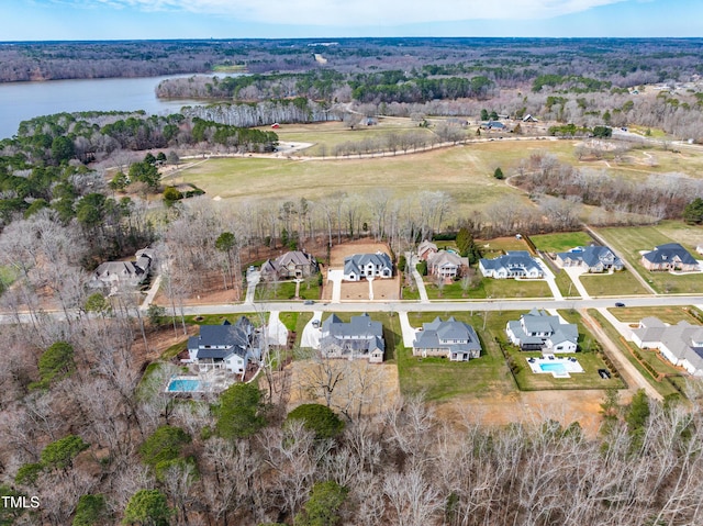 birds eye view of property featuring a water view and a residential view