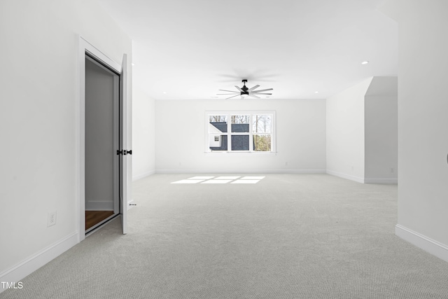 unfurnished room with light carpet, baseboards, a ceiling fan, and recessed lighting