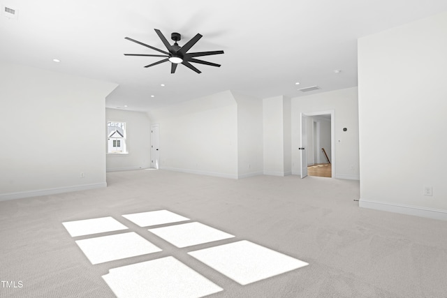 unfurnished room featuring recessed lighting, baseboards, visible vents, and light colored carpet