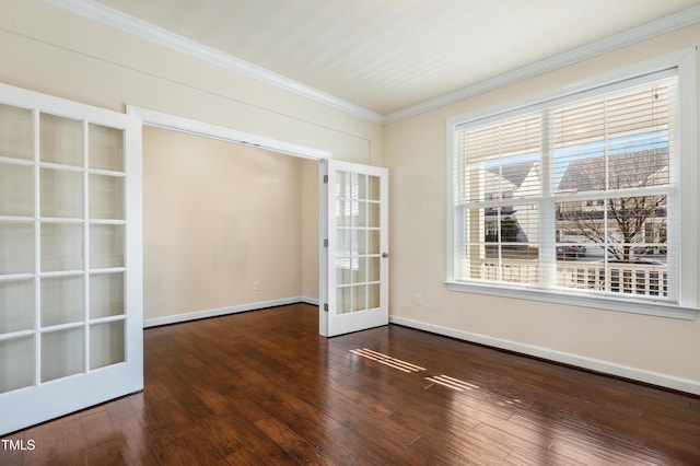 unfurnished room with french doors, ornamental molding, wood-type flooring, and baseboards