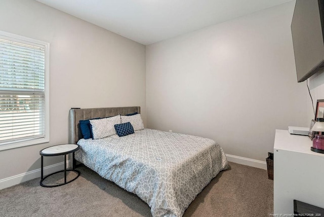 carpeted bedroom with baseboards