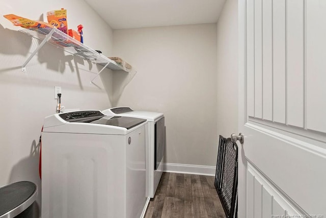 washroom with laundry area, dark wood-type flooring, independent washer and dryer, and baseboards