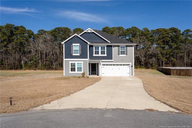 view of front of property with a garage and driveway