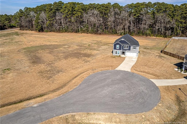 aerial view with a wooded view