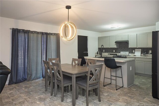 dining space featuring stone finish flooring