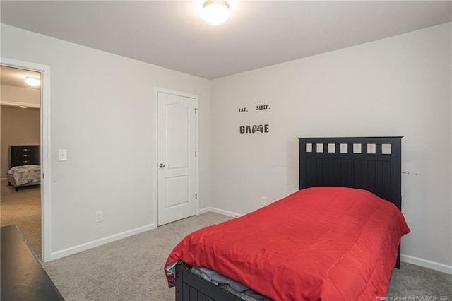 carpeted bedroom with baseboards