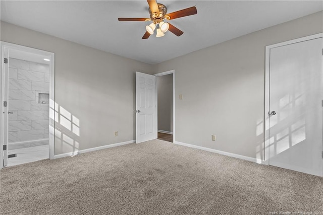 unfurnished bedroom featuring a ceiling fan, carpet flooring, connected bathroom, and baseboards