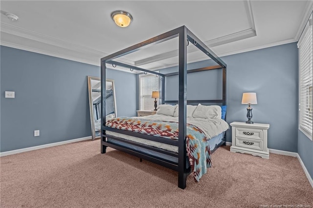 carpeted bedroom with ornamental molding and baseboards