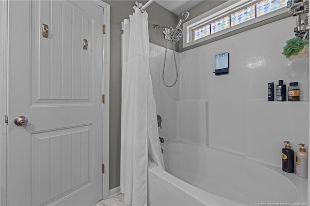 bathroom with shower / bathtub combination with curtain