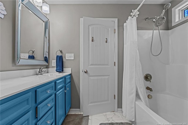 full bathroom with shower / bath combo, marble finish floor, and vanity